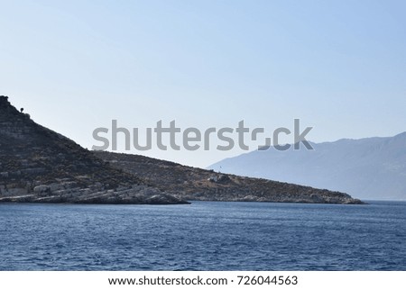 A mountain view and the Mediterranean   sea with a clear blue sky background.
