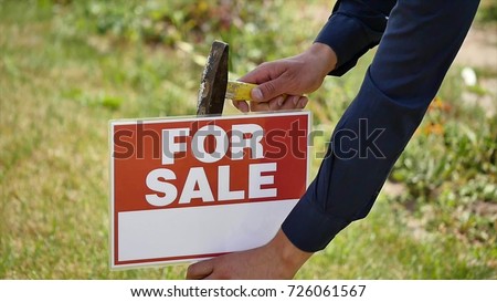 male hands hammer sign for sale