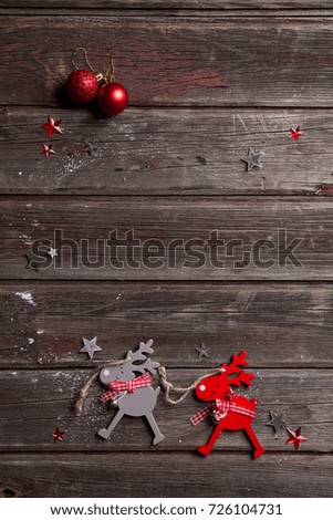 Christmas background with christmas decorations and reindeer on wooden board, selective focus