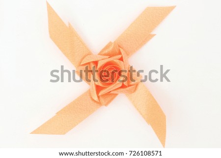 Rose with ribbon.