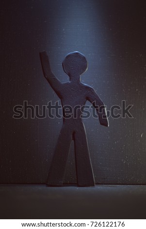 a figure black man on a dark background
