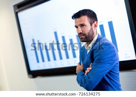Picture of businessman talking on seminar in conference room