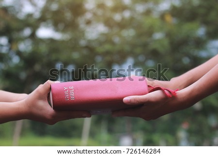 Woman hands giving Bible and evangelizing someone,Gospel 
