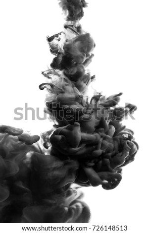 Acrylic black and white paint and ink in water. Abstract background. Isolated on white. smoke
