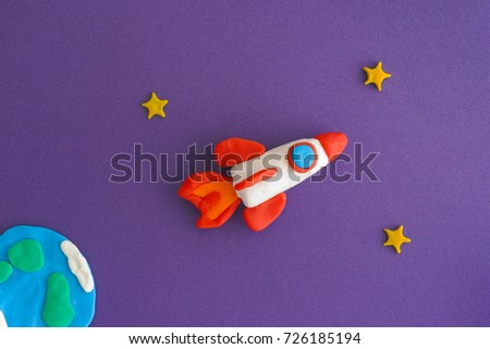 Space Rocket Blasting Off For New Ideas. Earth, space rocket and stars are made out of play clay (plasticine).