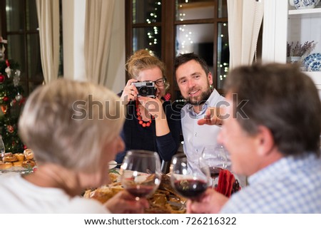 Young couple celebrating Christmas together at home.