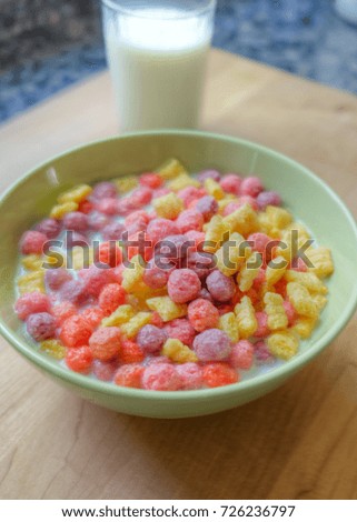 Bowl of breakfast cereal with a glass of milk