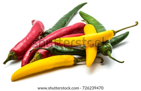 Group of colorful Chili peppers isolated on white background