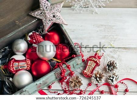 New Year and Christmas decorations, garlands and balls in a box. Christmas card, holiday concept