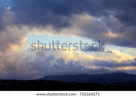 Dark moody cloudy sky above the mountains