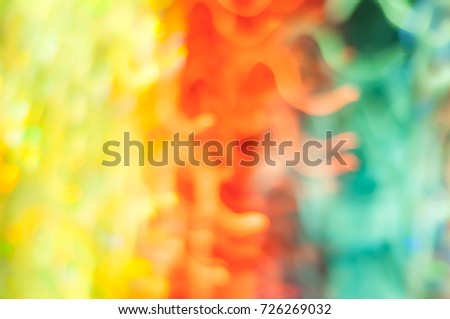 Blurred green, yellow and red lights with bokeh in motion. Abstract background