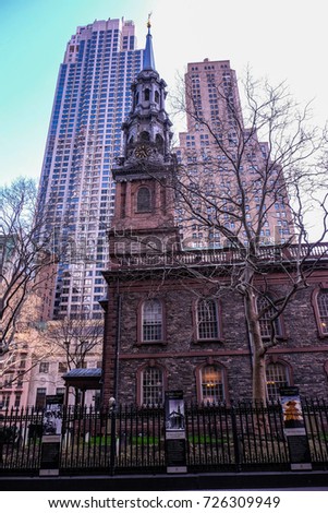 view of the Saint Paul Chapel with two skyscrapers in the background, Manhattan, Financial district, New York USA