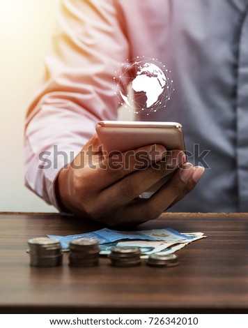 Technology people global network and online banking internet banking mobile banking concept, Business man with smartphone on office table, save account banking for finance Credit by NASA Royalty-Free Stock Photo #726342010
