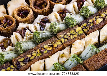 Mixed Turkish baklava and desserts in high resolution background.