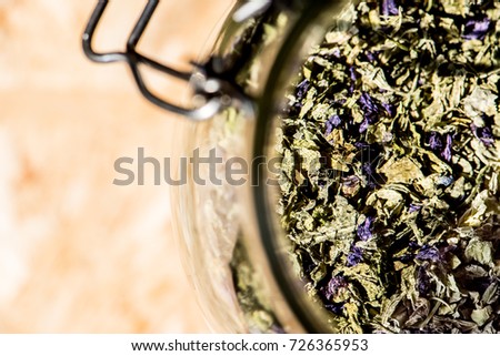 glass jar full of mallow, leaves and flowers for healthy infusion, mallow tea