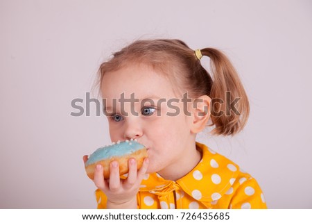 Little Girl Eating Donuts in isolated White Background