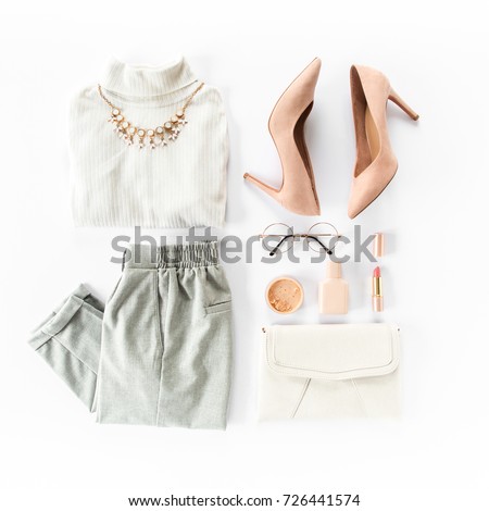 Woman clothes and accessories set on white background top view. modern and casual outfit. fashion, shopping and makeup concept. Flat lay, top view.  Royalty-Free Stock Photo #726441574