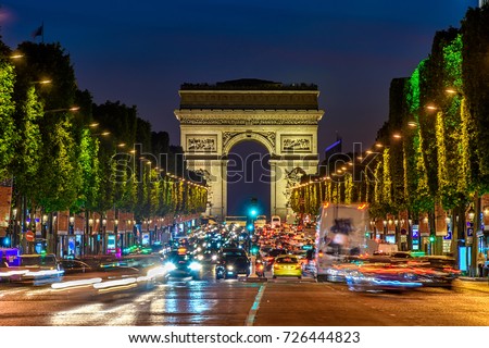 Champs-Elysees and Arc de Triomphe at night in Paris, France. Architecture and landmarks of Paris. Postcard of Paris Royalty-Free Stock Photo #726444823