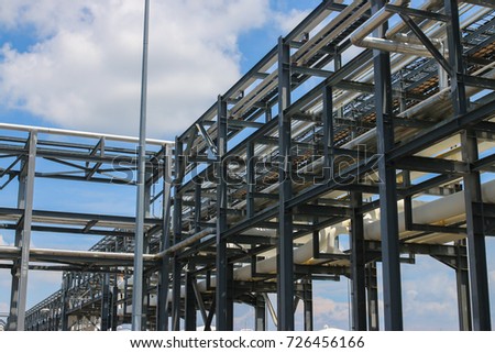 Process pipe rack with clear blue skies in the background. Royalty-Free Stock Photo #726456166