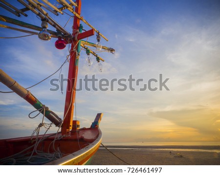  fishing boat, on the beach with sun and sky background 