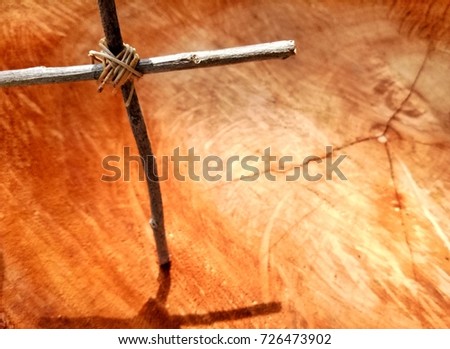 Close up wooden strength Christ cross on wood surface background with selective focus