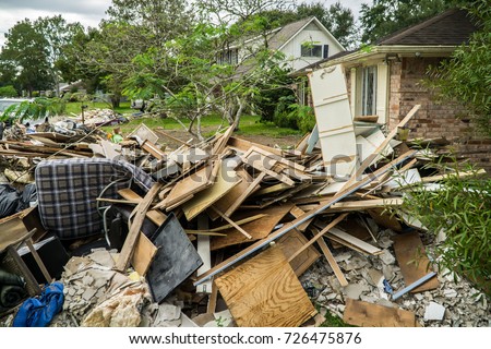 Trash and debris outside of neighborhoods devastated by Hurricane Harvey  Royalty-Free Stock Photo #726475876