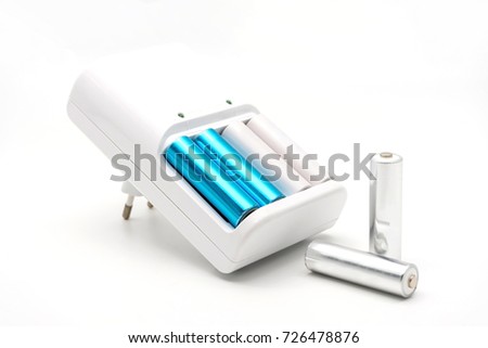 AA batteries rechargeable in accumulator charger, isolated on a white background Royalty-Free Stock Photo #726478876
