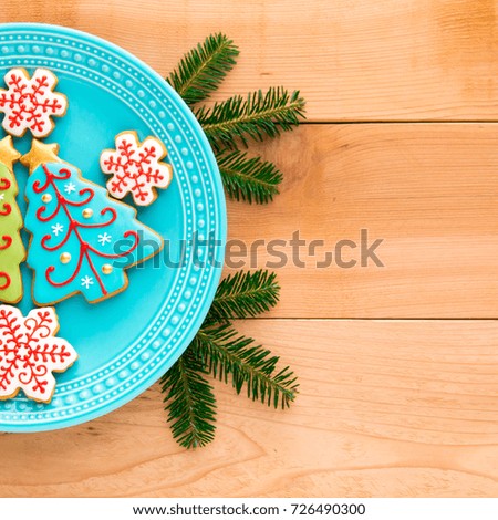 Christmas homemade snowflake  and christmas tree cookies on plate with copy space.