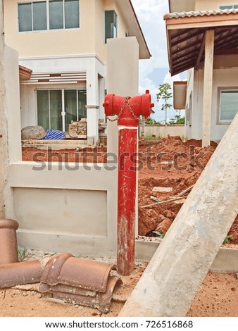 Red fire tube at construction site