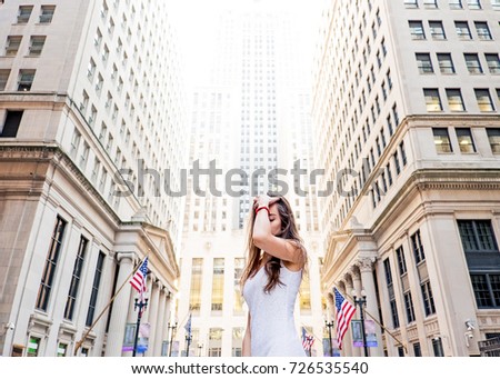 girl tourist in a dress with a walk around the city