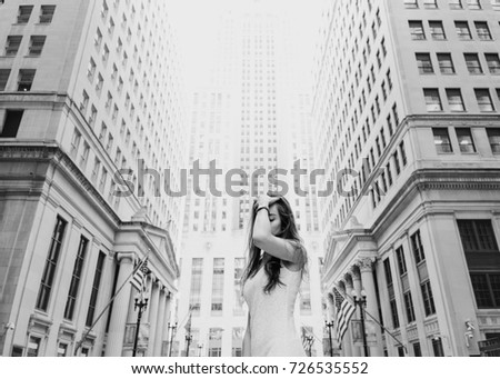 girl tourist in a dress with a walk around the city black and white