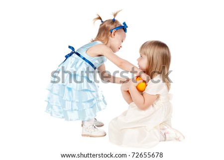 Two girls share an orange