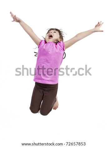 Adorable and happy little girl jumping in air. isolated on white background