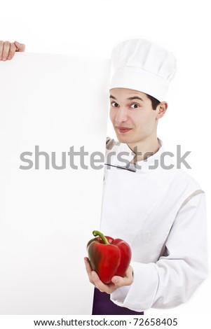 Attractive young caucasian man chef with uniform and hat, holding peppers