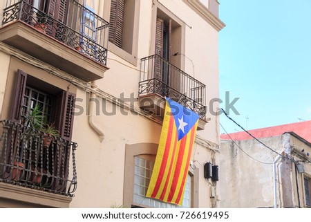 Estelada flag with star on balcony.