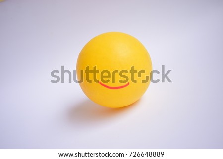 a yellow ball with Smiley face (smiley).On white background.