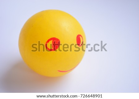 a yellow ball with Smiley face (smiley).On white background.