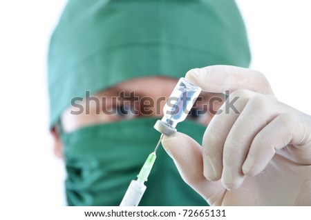 Doctor with syringe in hands, getting ready for injection isolated on white background