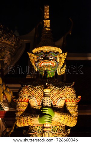 Wat Phra Kaew, commonly known in English as the Temple of the Emerald Buddha and officially as Wat Phra Si Rattana Satsadaram,and giant decoration and big pagoda on night time , Bangkok ,Thailand
