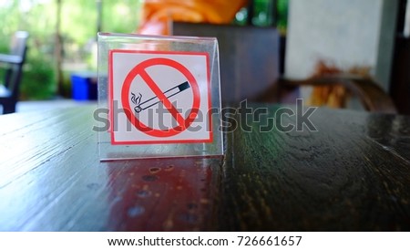 No smoking sign with copy space on wooden background.