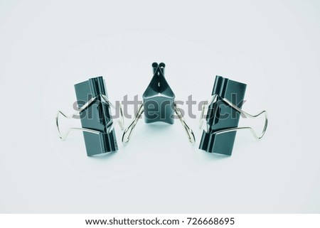 Black Paper clip isolated on white background.                               