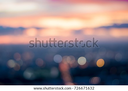 Blurry Background and copy space of cityscape concept with cloud and sky at the twilight time or sunset time with soft focus and pastel tone 