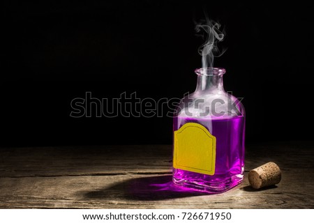 Glass vial with a purple potion on a dark background. Magic elixir. Copy space for text. 3D rendering Royalty-Free Stock Photo #726671950