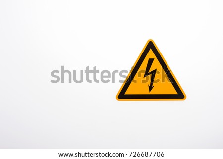 High voltage yellow triangle warning sign isolated