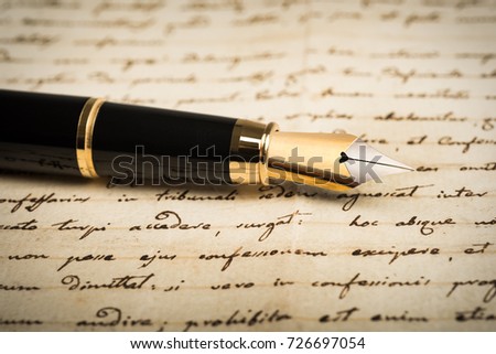 Fountain pen on letter background Royalty-Free Stock Photo #726697054
