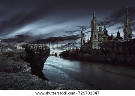 View of dark castle with dark sky at night Royalty-Free Stock Photo #726701347