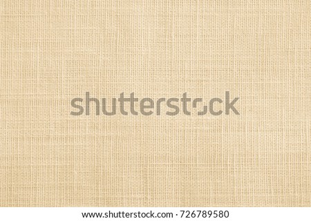 Jute hessian sackcloth canvas sack cloth woven texture pattern background  in yellow beige cream brown color Royalty-Free Stock Photo #726789580