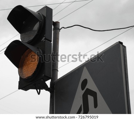 traffic light orahge pedestrian sign
