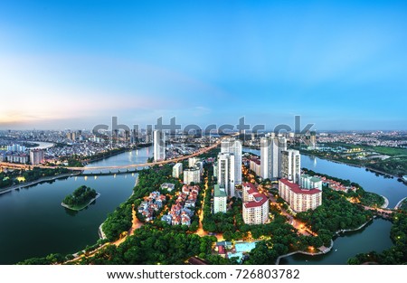 Aerial skyline view of Hanoi cityscape at twilight. Linh Dam peninsula, Hoang Mai district, Hanoi, Vietnam Royalty-Free Stock Photo #726803782