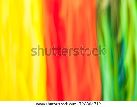 Blurred yellow, red and green lights in motion. Abstract background